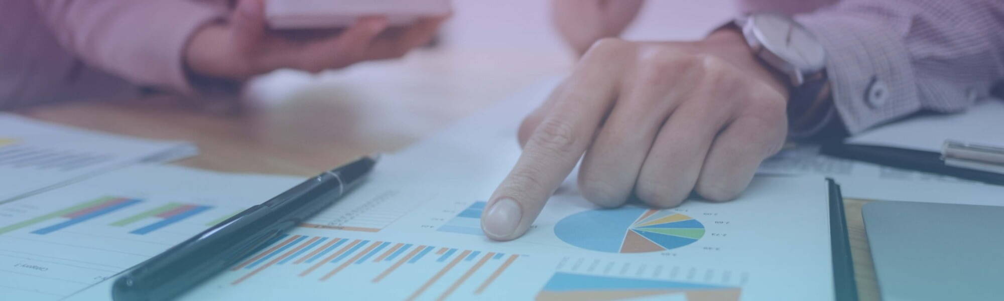 People looking over printed reports