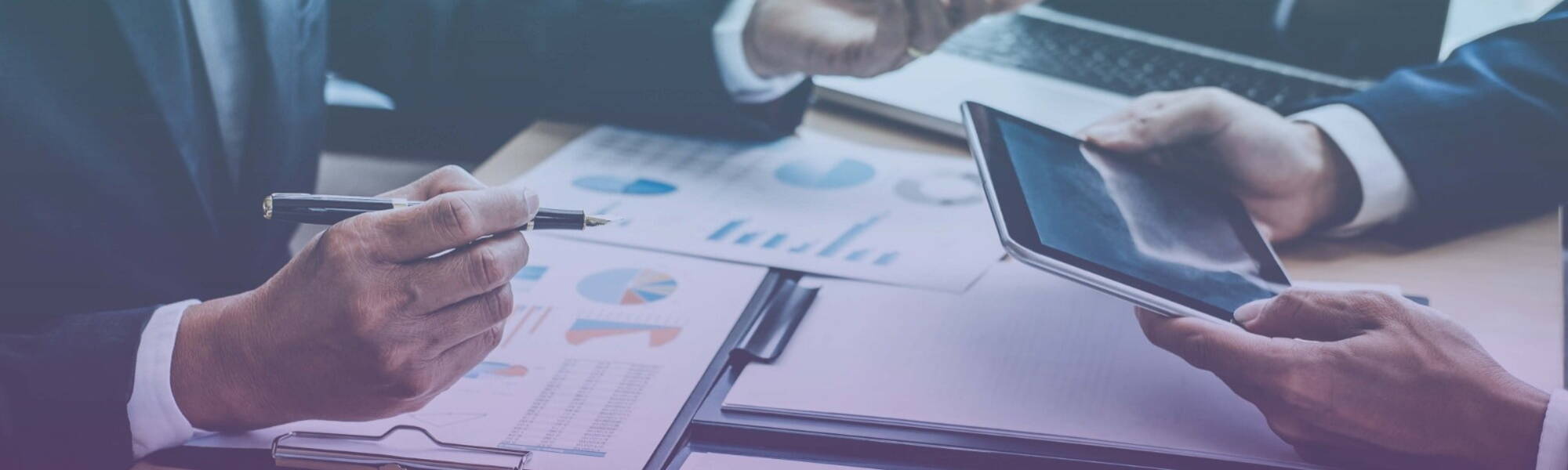 Two people looking at finance reports