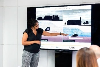 Woman giving a presentation to audience