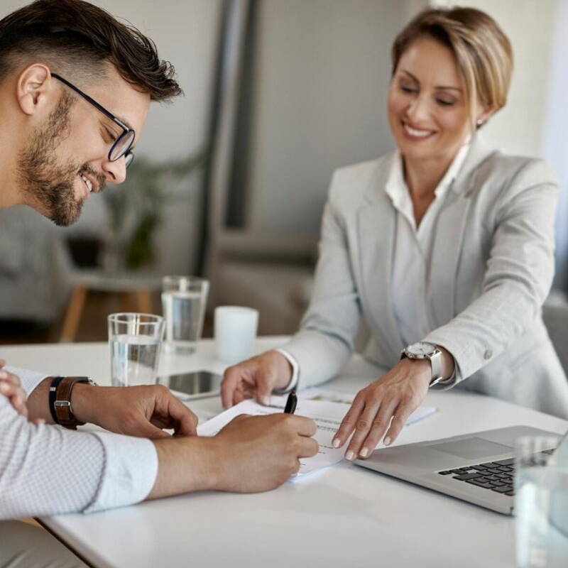 Man signing insurance papers